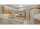 Bright kitchen, granite countertops, and stainless steel appliances at 4440 Calle Serena, Sarasota, FL 34238