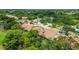 Aerial perspective of villas nestled in a tree-lined community at 4440 Calle Serena, Sarasota, FL 34238