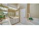 Bathroom with double sinks, shower, and garden tub at 4440 Calle Serena, Sarasota, FL 34238
