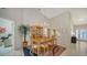 Bright dining room features a wood table with seating for six and a large hutch at 4440 Calle Serena, Sarasota, FL 34238