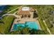 L-shaped community pool with covered seating area at 4440 Calle Serena, Sarasota, FL 34238