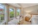 Relaxing bedroom with bay window and comfortable seating at 4440 Calle Serena, Sarasota, FL 34238