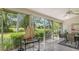 Bright sunroom featuring a view of the lush green landscape at 4440 Calle Serena, Sarasota, FL 34238