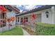 Side entrance with walkway, wrought iron gate and tropical plants at 4440 Calle Serena, Sarasota, FL 34238