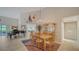 Spacious dining room with wood table, hutch, and access to other rooms at 4440 Calle Serena, Sarasota, FL 34238