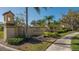 Villa Palmeras community entrance with lush landscaping and signage at 4440 Calle Serena, Sarasota, FL 34238