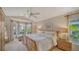 Spacious main bedroom with bay window and king-size bed at 4440 Calle Serena, Sarasota, FL 34238