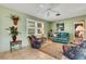 Bright living room with comfy seating and large windows at 1255 Lincoln Dr, Englewood, FL 34224