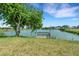 Scenic lakefront property with private dock and lush lawn at 1255 Lincoln Dr, Englewood, FL 34224