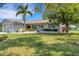 Single story home with a landscaped yard at 1255 Lincoln Dr, Englewood, FL 34224