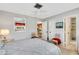 Charming bedroom with a queen bed and view of the kitchen at 1255 Lincoln Dr, Englewood, FL 34224