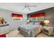 Relaxing bedroom featuring a queen-size bed and two windows at 1255 Lincoln Dr, Englewood, FL 34224
