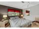 Serene bedroom with a queen bed and large mirror at 1255 Lincoln Dr, Englewood, FL 34224