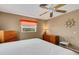 Comfortable bedroom with a king-size bed and dresser at 1255 Lincoln Dr, Englewood, FL 34224