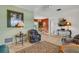 Living room with comfortable seating and view to dining area at 1255 Lincoln Dr, Englewood, FL 34224