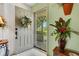 Inviting entryway with a wreath and a decorative flower arrangement at 1255 Lincoln Dr, Englewood, FL 34224