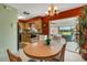 Kitchen and dining area with access to a relaxing patio at 1255 Lincoln Dr, Englewood, FL 34224