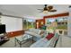 Bright sunroom with canal views and seating area at 1255 Lincoln Dr, Englewood, FL 34224