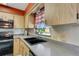 Kitchen with granite countertops and modern appliances at 1255 Lincoln Dr, Englewood, FL 34224