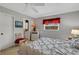 Cozy bedroom with a queen-size bed and private bathroom access at 1255 Lincoln Dr, Englewood, FL 34224