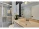 Elegant bathroom with marble vanity and walk-in shower at 1255 Lincoln Dr, Englewood, FL 34224