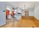 Bright dining room with wood flooring and adjacent kitchen at 1508 45Th E Ave, Ellenton, FL 34222