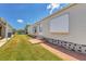 Side view of the home showcasing landscaping at 1508 45Th E Ave, Ellenton, FL 34222