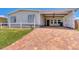 Mobile home with carport and brick paved driveway at 1508 45Th E Ave, Ellenton, FL 34222