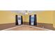 Spacious bedroom with yellow walls, wood flooring, and ceiling fan at 1508 45Th E Ave, Ellenton, FL 34222