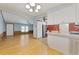 Kitchen with white cabinets, light walls, and wood flooring at 1508 45Th E Ave, Ellenton, FL 34222