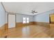 Simple living room with wood-look floors and ceiling fan at 1508 45Th E Ave, Ellenton, FL 34222