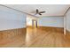 Living room with light walls, wood-look flooring, and ceiling fan at 1508 45Th E Ave, Ellenton, FL 34222