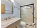 Bathroom features granite countertop, light cabinets, and a shower at 1508 45Th E Ave, Ellenton, FL 34222