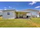 Rear view of home with covered patio, shed, and AC unit at 1508 45Th E Ave, Ellenton, FL 34222