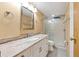 Bathroom with granite countertop, white cabinets, and a walk-in shower at 1508 45Th E Ave, Ellenton, FL 34222