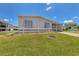 Single wide home with covered carport and landscaped yard at 1508 45Th E Ave, Ellenton, FL 34222