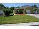 House exterior with a two-car garage and well-maintained lawn at 203 28Th W St, Palmetto, FL 34221