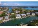 A stunning aerial view showcases the waterfront homes, private docks, and serene canal at 3550 Flamingo Ave, Sarasota, FL 34242