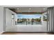 Spacious waterfront balcony with tile flooring, dark wood ceilings, and panoramic views at 3550 Flamingo Ave, Sarasota, FL 34242