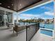 Balcony overlooking the water with outdoor seating and a view of the pool at 3550 Flamingo Ave, Sarasota, FL 34242