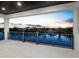 A covered balcony shows a waterfront view, metal railings, and a decorative ceiling, perfect for enjoying the sunset at 3550 Flamingo Ave, Sarasota, FL 34242
