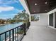 A comfortable balcony overlooking the canal waters, with a view of the neighborhood at 3550 Flamingo Ave, Sarasota, FL 34242