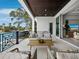 Spacious waterfront balcony with comfortable seating, offering a perfect spot for relaxation at 3550 Flamingo Ave, Sarasota, FL 34242