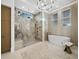 Spa-like bathroom with a luxurious soaking tub, glass-enclosed shower, and elegant finishes for a relaxing retreat at 3550 Flamingo Ave, Sarasota, FL 34242