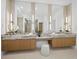 Luxurious bathroom featuring double vanities with elegant countertops, modern lighting, and stylish fixtures for a spa-like experience at 3550 Flamingo Ave, Sarasota, FL 34242