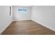 Bright bedroom with hardwood floors and windows, offering a serene and simple design at 3550 Flamingo Ave, Sarasota, FL 34242