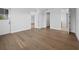 Bright bedroom featuring hardwood floors, neutral walls, and multiple doorways offers a versatile and inviting living space at 3550 Flamingo Ave, Sarasota, FL 34242
