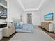 Bright bedroom features hardwood floors, a modern tray ceiling, and a stylish neutral color palette at 3550 Flamingo Ave, Sarasota, FL 34242
