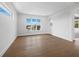 Bright bedroom with hardwood floors and large windows providing natural light at 3550 Flamingo Ave, Sarasota, FL 34242