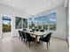 Bright dining room with large windows overlooking the water and stylish decor at 3550 Flamingo Ave, Sarasota, FL 34242
